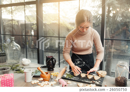 Female confectioner cooking at kitchen Female confectioner cooking at kitchen 26050750