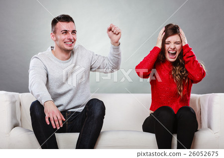 Furious wife and happy husband. Disagreement Furious wife and happy husband. Disagreement 26052675