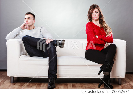 Young couple after quarrel sitting on sofa 26052685