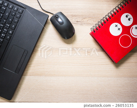 laptop and notebook on the table on working day 26053135