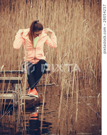 woman runner resting after workout run 26054257