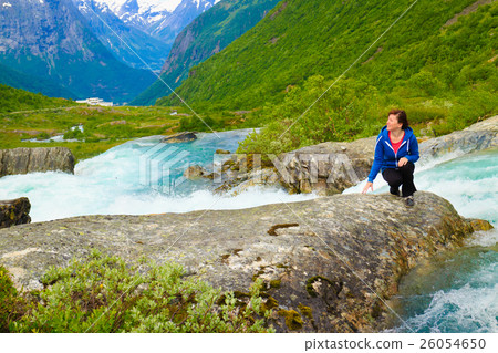Tourist woman by Videfossen Waterfall in Norway 26054650
