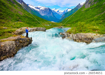 Tourist woman by Videfossen Waterfall in Norway Tourist woman by Videfossen Waterfall in Norway 26054651