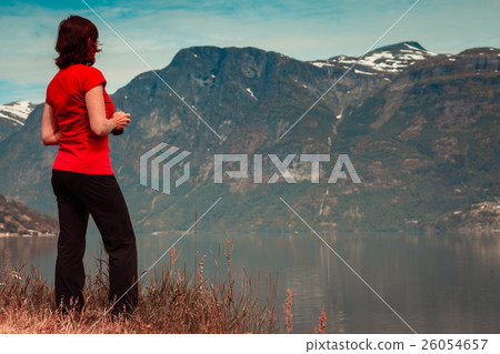 Tourist woman enjoying fjord view in Norway 26054657