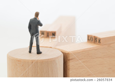 A businessman standing at a branch point 26057834