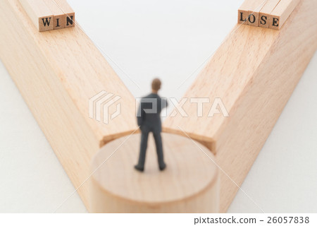 A businessman standing at a branch point 26057838