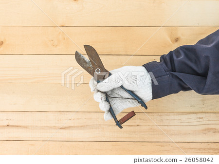 Hand in glove holding plier Hand in glove holding plier 26058042
