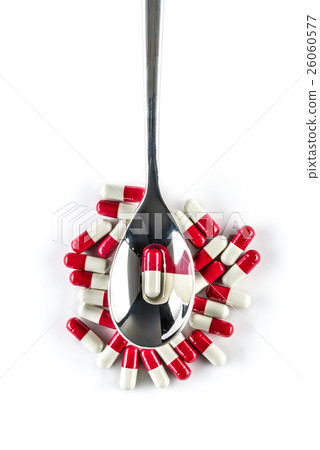 Capsules over silver spoon, Healthcare Medicine Capsules over silver spoon, Healthcare Medicine 26060577