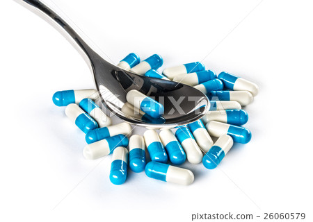 Capsules over silver spoon, Healthcare Medicine Capsules over silver spoon, Healthcare Medicine 26060579