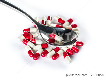 Capsules over silver spoon, Healthcare Medicine Capsules over silver spoon, Healthcare Medicine 26060580