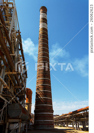 Tall chimney on fuel refinery factory 26062623