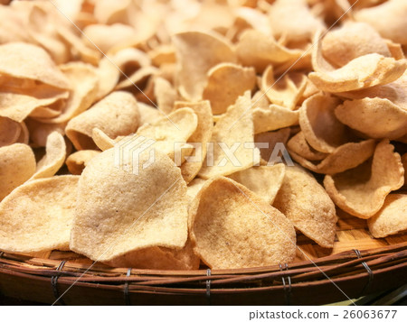 Prawn Shrimp Crackers on wooden container Prawn Shrimp Crackers on wooden container 26063677