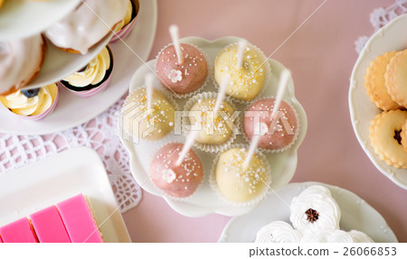Cake pops on cakestand and various cakes . Candy Cake pops on cakestand and various cakes . Candy 26066853
