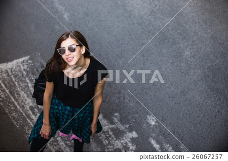 Brunette girl in rock black style, standing 26067257