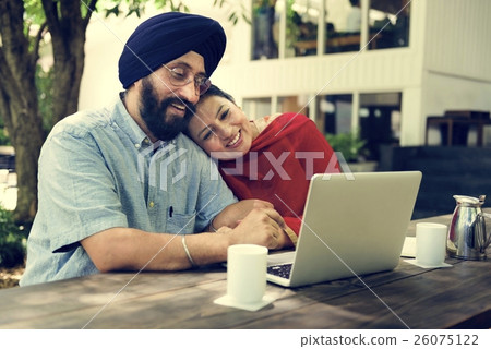 Indian Couple Using Device Concept Indian Couple Using Device Concept 26075122