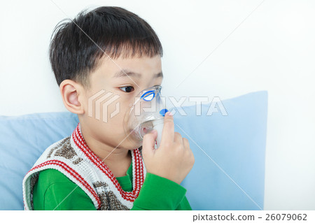 Asian child holds a mask vapor inhaler Asian child holds a mask vapor inhaler 26079062