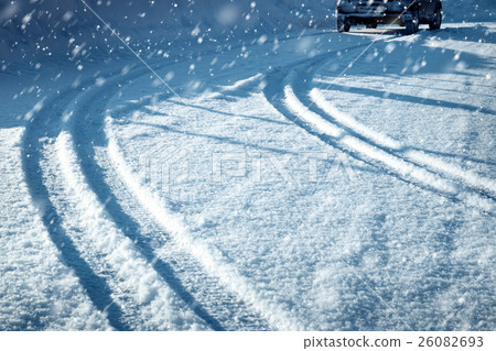 Car tires on winter road Car tires on winter road 26082693
