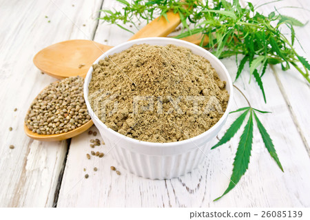 Flour hemp in bowl with spoons on light board 26085139