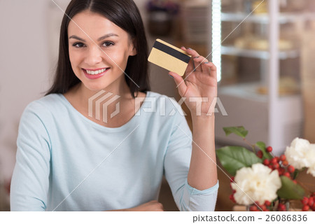 Beautiful woman presenting a discount card. 26086836