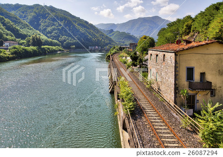 railroad along the river Serchio and Apuan Alps, Tuscany, Italy 26087294
