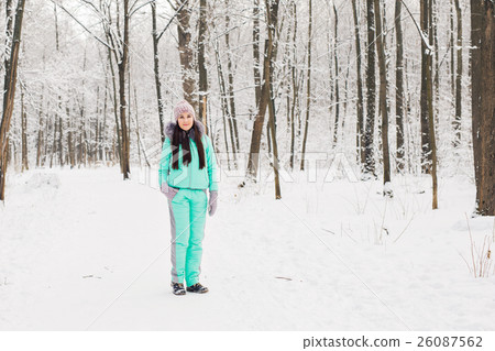 Beautiful young girl in a white winter forest Beautiful young girl in a white winter forest 26087562