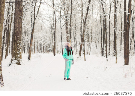 Beautiful young girl in a white winter forest 26087570