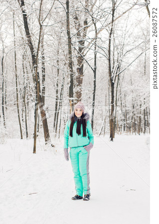 Beautiful young girl in a white winter forest 26087572