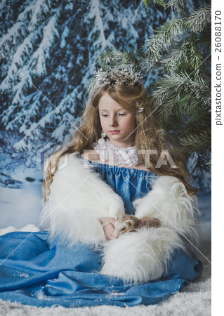 Snow Princess sits in the snow at Christmas trees 4574. 26088170