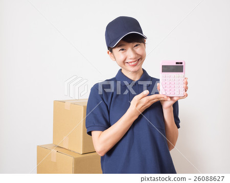 A woman with a calculator wearing a work cloth 26088627