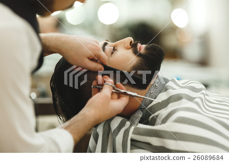 Barber making a beard 26089684