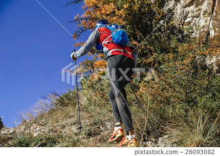 view back athlete with walking poles view back athlete with walking poles 26093082