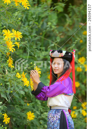 Beautiful Lahu tribe girl hold mexico sunflower 26094157
