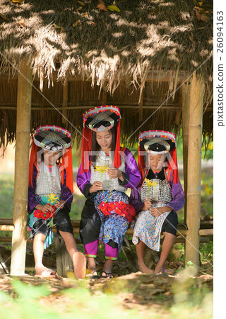 Three asian Lahu girls sit in hut und sunlight. 26094163