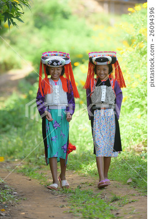 Happy beautiful Lahu tribe among mexico sunflower Happy beautiful Lahu tribe among mexico sunflower 26094396