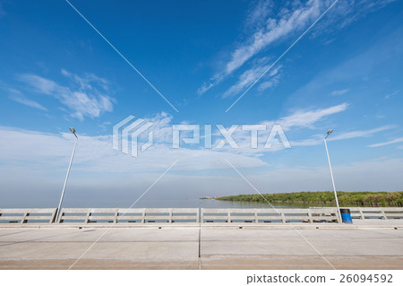 Beach bridge with cloudy blue sky Beach bridge with cloudy blue sky 26094592
