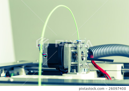 3d printer with bright green filament. 26097408