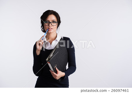 Smiling pretty young business woman in glasses Smiling pretty young business woman in glasses 26097461