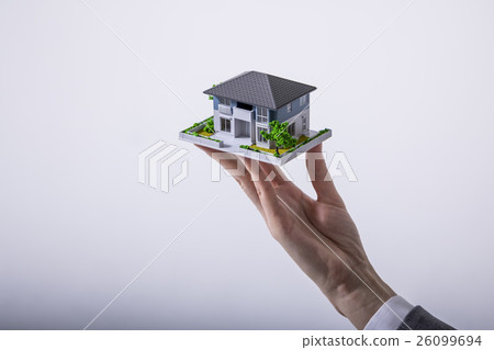 Housing model supported by hand Housing model supported by hand 26099694