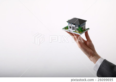 Housing model supported by hand 26099695