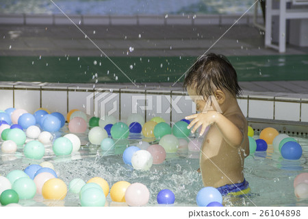 1 year old child playing in children's pool 26104898