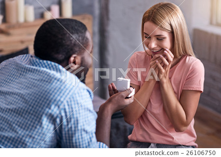 Young man proposing marriage to his girlfriend 26106750
