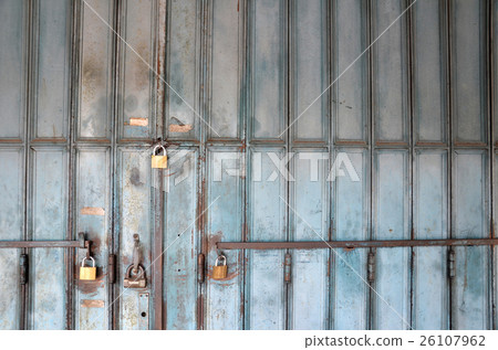 Metal lock on a blue door Metal lock on a blue door 26107962