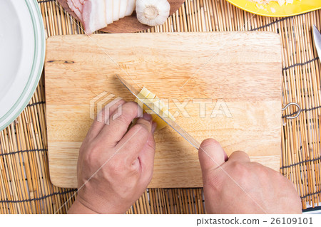 Chef cutting cheese with knife before cooking Chef cutting cheese with knife before cooking 26109101
