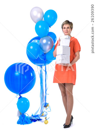 young woman in bright dress with gift boxes and 26109390