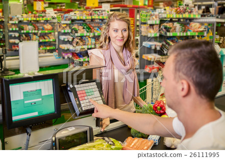 Woman buying food at supermarket Woman buying food at supermarket 26111995