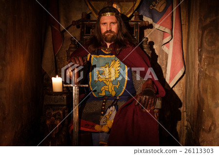 Medieval king on throne in ancient castle interior Medieval king on throne in ancient castle interior 26113303
