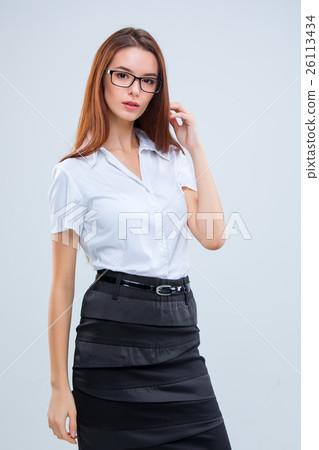 The smiling young business woman on gray  26113434