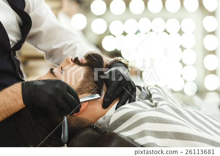 Hands in gloves making beard form 26113681