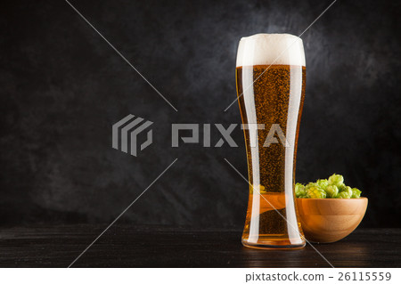 Beer glass on dark background Beer glass on dark background 26115559