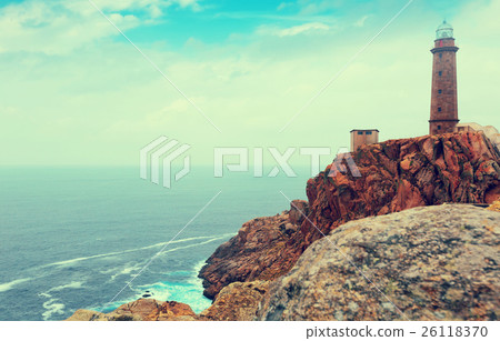 Imitation of vintage photo with the lighthouse on the rocky coast Imitation of vintage photo with the lighthouse on the rocky coast 26118370